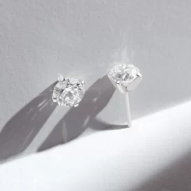 Aros solitarios en oro blanco 18k y brillantes certificados